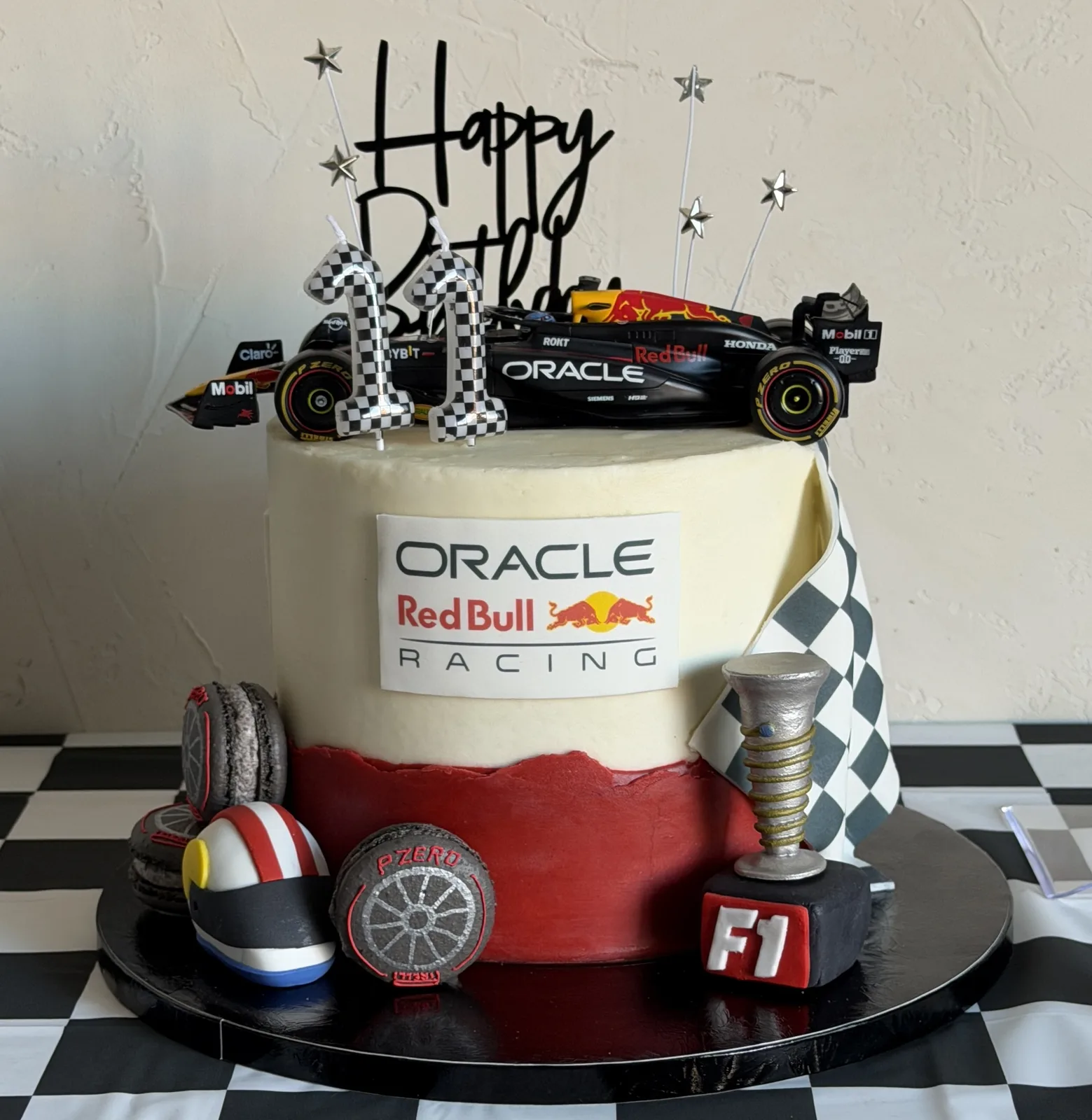 F1-themed birthday cake with a Red Bull Racing car topper